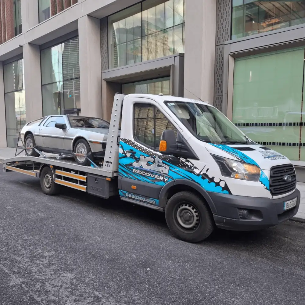 JC Recovery – Car Collection transporting a DMC vintage car (1)
